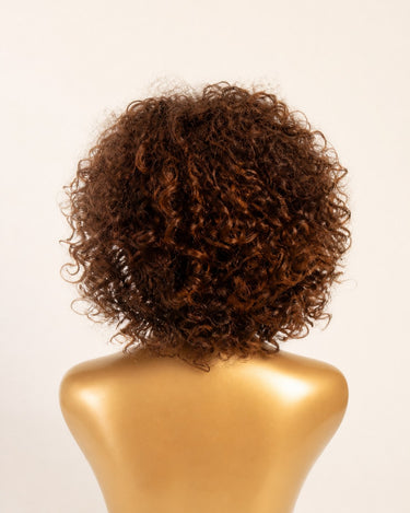 Moxi Loxi Sample Piece warm brown highlighted curly human hair wig, back view showing the curl pattern.