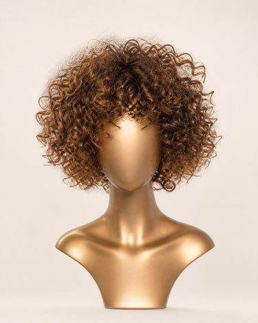 Moxi Loxi Sample Piece human hair wig in warm brown with highlights, front view on a smooth gold display form.