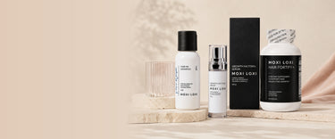 Pure Wash, Growth Factors+ serum, and Hair Fortify+ arranged as a three step scalp care regimen.