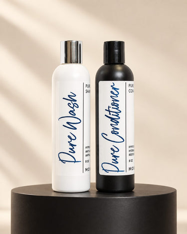 Moxi Loxi Pure Care Duo with 8 oz Pure Wash and Pure Conditioner on an ivory salon pedestal