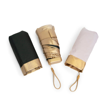 Moxi Loxi Signature Travel Umbrella, a compact purse-sized umbrella with an aluminium shaft and ribs and the Moxi Loxi logo.