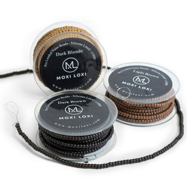 Moxi Loxi preloaded silicone nano rings for hair extensions, silicone-lined beads that grip the hair gently and sit discreetly at the root.