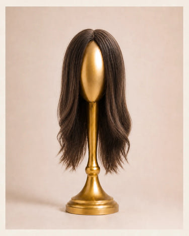 Front view of The Motion archive wig in Cool Truffle, 16 inch length, on a smooth featureless gold display head.