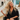 A woman with long blonde hair seated in the boutique.