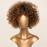 Moxi Loxi Sample Piece human hair wig in warm brown with highlights, front view on a smooth gold display form.