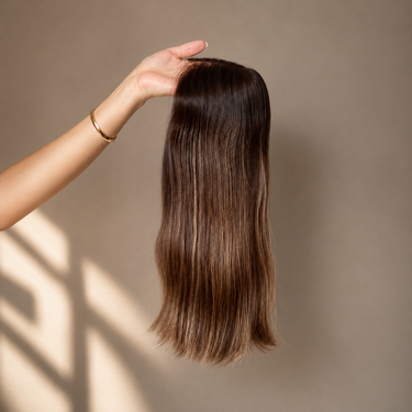Back view of the Moxi Loxi Elena ultra-thin Silk Veil™ Technology wig showcasing premium European human hair, naturally light density, and smooth, straight styling.
