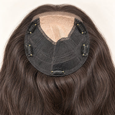 Interior of the Moxi Loxi Lumi topper showing the lace front, silk top, mesh base and five pressure-sensitive clips.