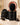 Moxi Loxi Voyage black travel case open with the styling head packed inside beside the storage bag, brush and suction base