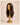 Three quarter view of The Motion archive wig in Cool Truffle showing its chocolate root, soft layers, and 16 inch length.