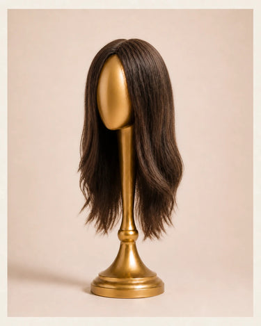 Three quarter view of The Motion archive wig in Cool Truffle showing its chocolate root, soft layers, and 16 inch length.